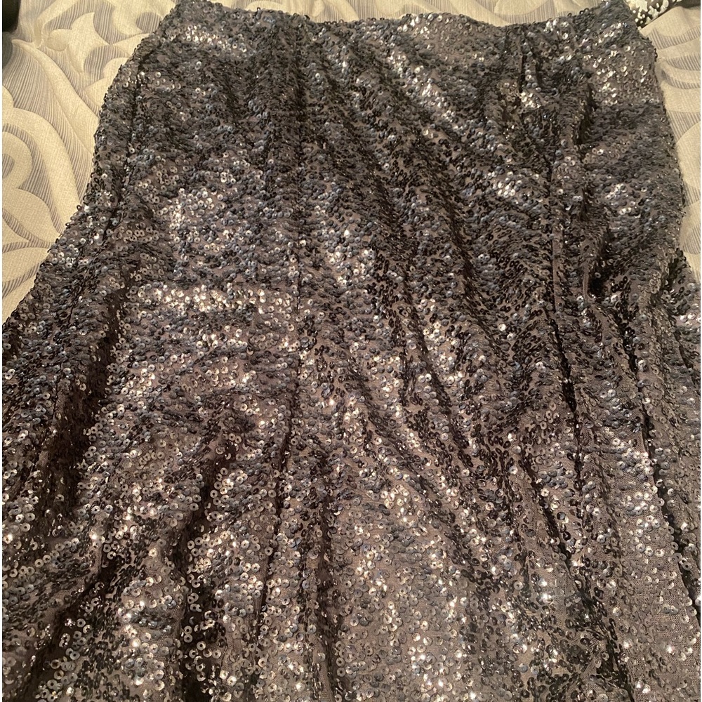 Silver sequined slightly above knee skirt